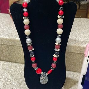 Gorgeous beaded glass necklace with several wooden beads and zebra print. LOVE